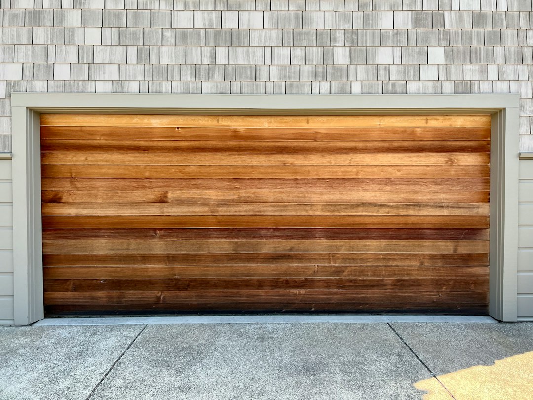 A wooden garage door on a brick building in Huntington Beach, CA